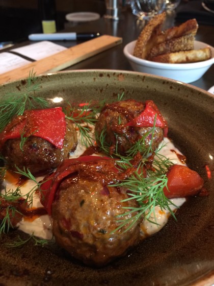 Lamb Merguez meatballs with glazed carrots, tzatziki and dill at Oso. 