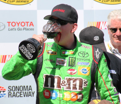 Kyle Busch drinks the wine (Highway 12 Cabernet Sauvignon) as the winner of the 2015 Toyota/Save Mart  (Photo: Sarah Stierch, CC BY 4.0)