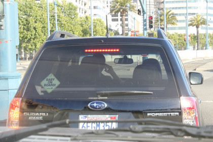 A distracted driver with a baby on board (dizzylizzy1227, CC BY NC 2.0)