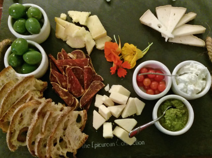 A beautiful cheese plate at the Epicurean Connection complete with edible nasturtium