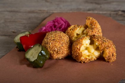 Fried food helps with a hangover, right? The mac and cheese fritters at Cochon Volant (Photo: Facebook)