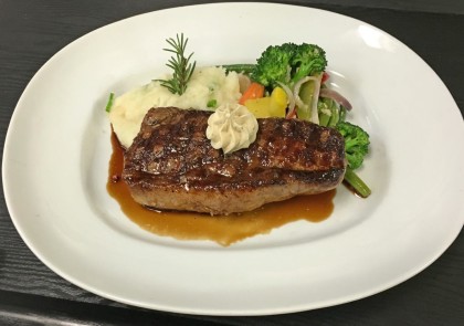 Saddles Steakhouse offers a New York Strip with all the fixings - and a salad and dessert - for $39! (Photo: Saddles Steakhouse)