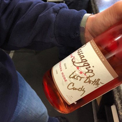 The cool thing about small lot producers - they're often in the tasting room. Cosco signs away her last bottle of Barbera rose to a lucky buyer. (Photo: Sarah Stierch)