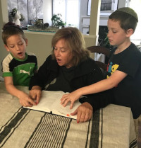 Bonnie Walner preps for her second Bat Mitzvah, 60 years after the first, by reading The Torah with her grandkids. “One of the greatest messages from the Torah has been to treat others as you would like to be treated,” she said.