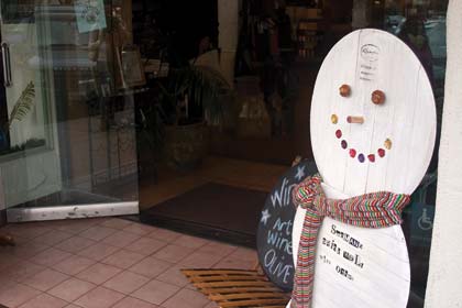 This snowman has a cork for a nose.